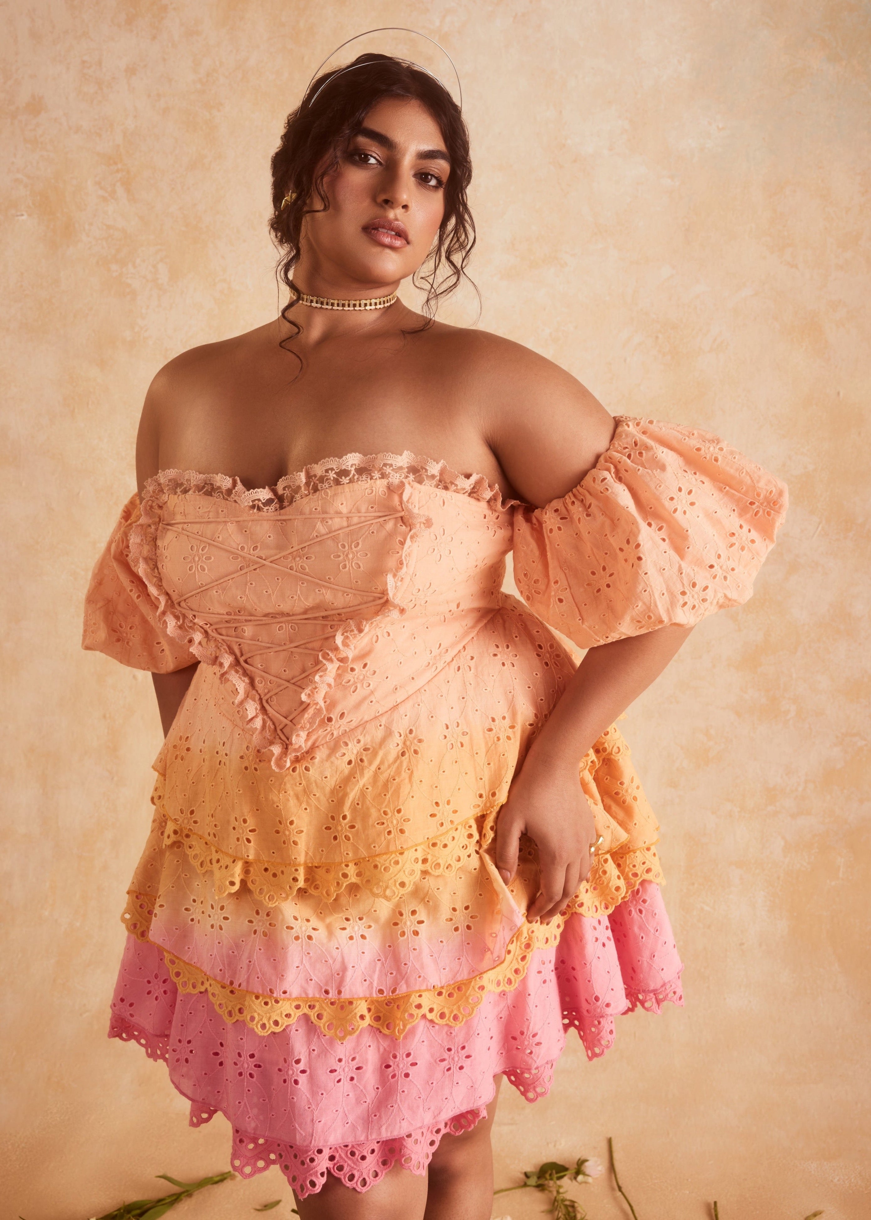 Stevie Sunset Ombre Schiffli Ruffled Corset Mini Dress, featuring a gradient sunset ombre design with Schiffli embroidery and ruffled details.
