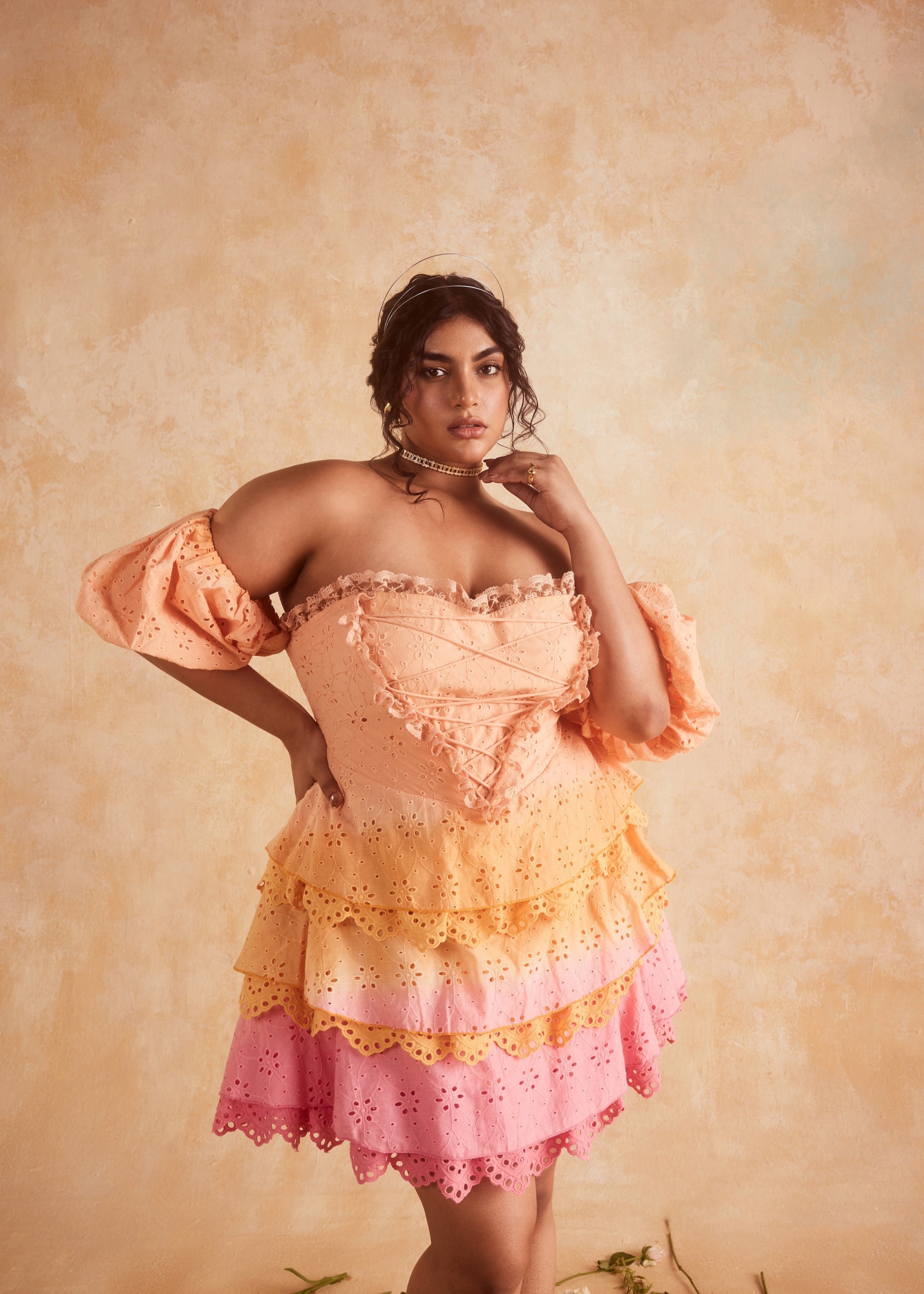 Stevie Sunset Ombre Schiffli Ruffled Corset Mini Dress, featuring a gradient sunset ombre design with Schiffli embroidery and ruffled details.