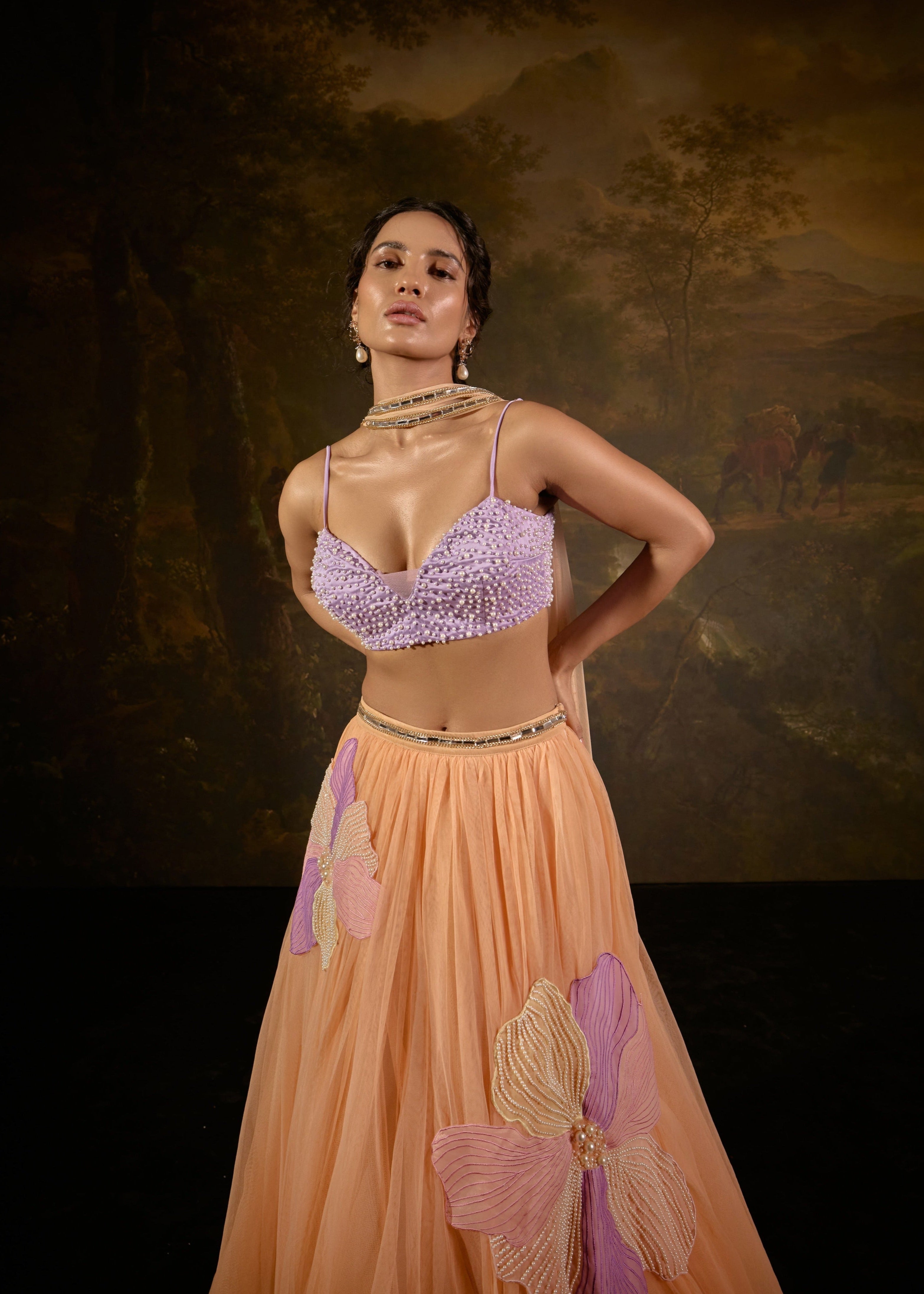 "Tasmeekh Lavender And Orange Embroidered Lehenga Set: Vibrant lehenga set with intricate embroidery in lavender and orange, perfect for a festive look."