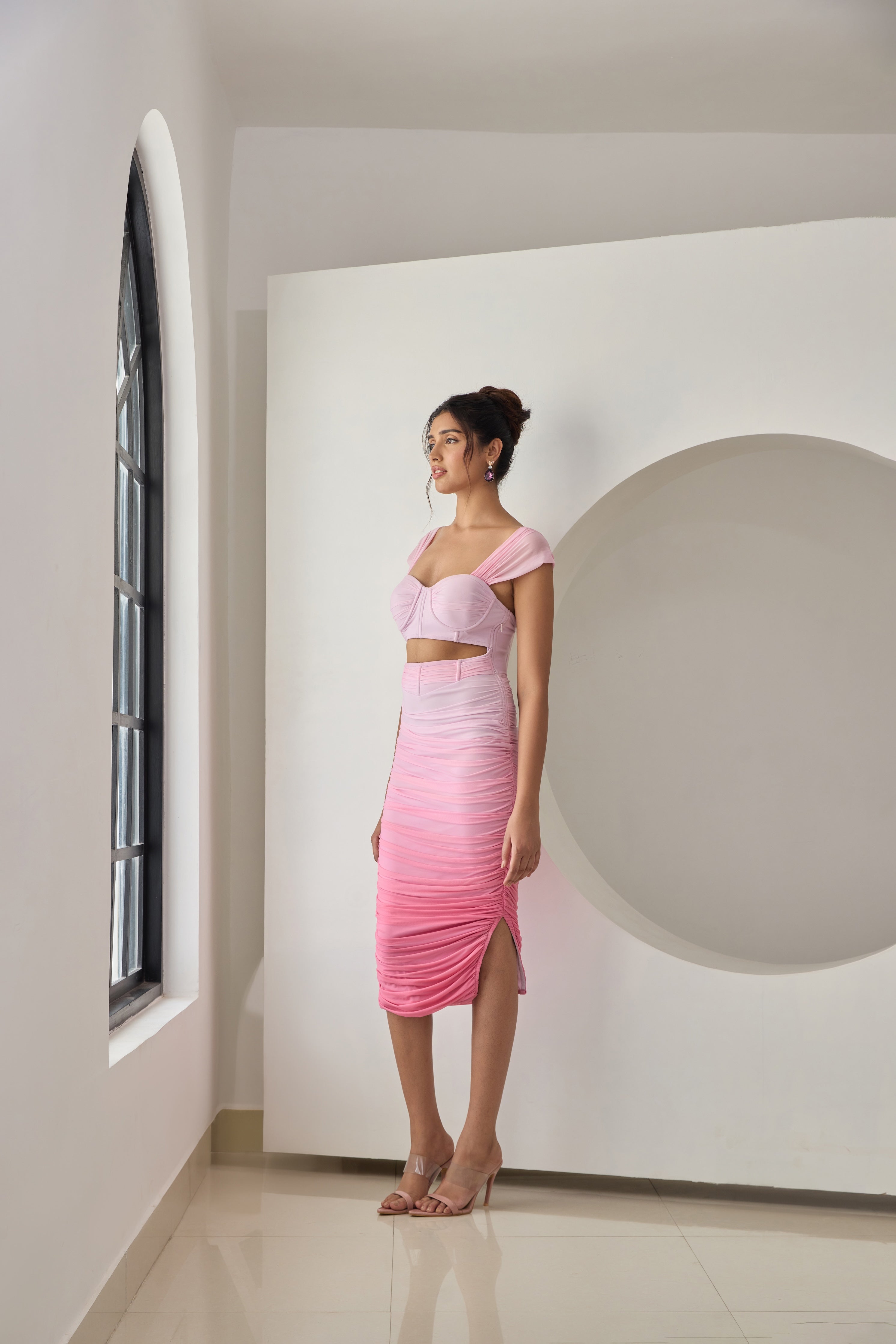 Pink ombre ruched mesh midi corset dress with a fitted bodice and flowing skirt