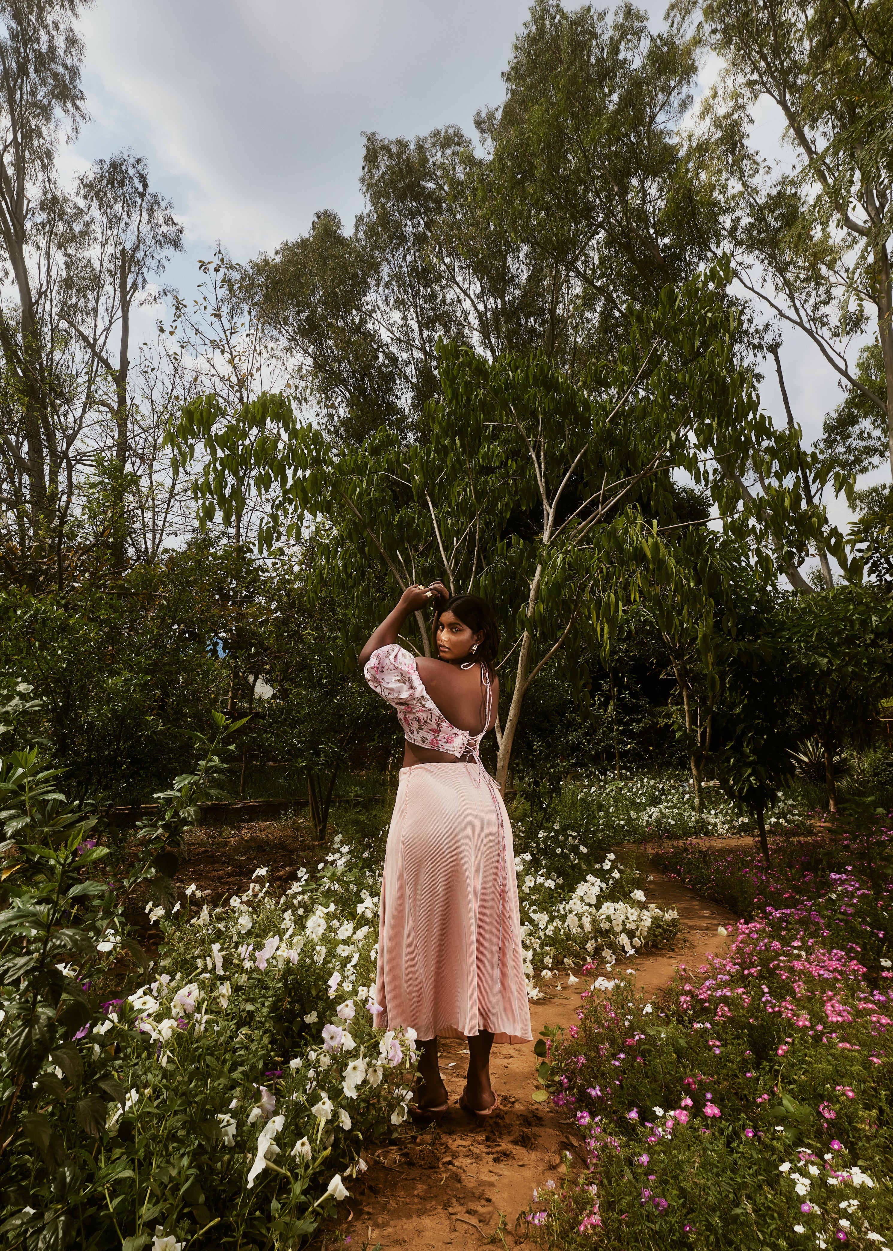 Venetia Peach Floral Top & Pleated Skirt Set with a floral-patterned top and a pleated skirt in a soft peach shade