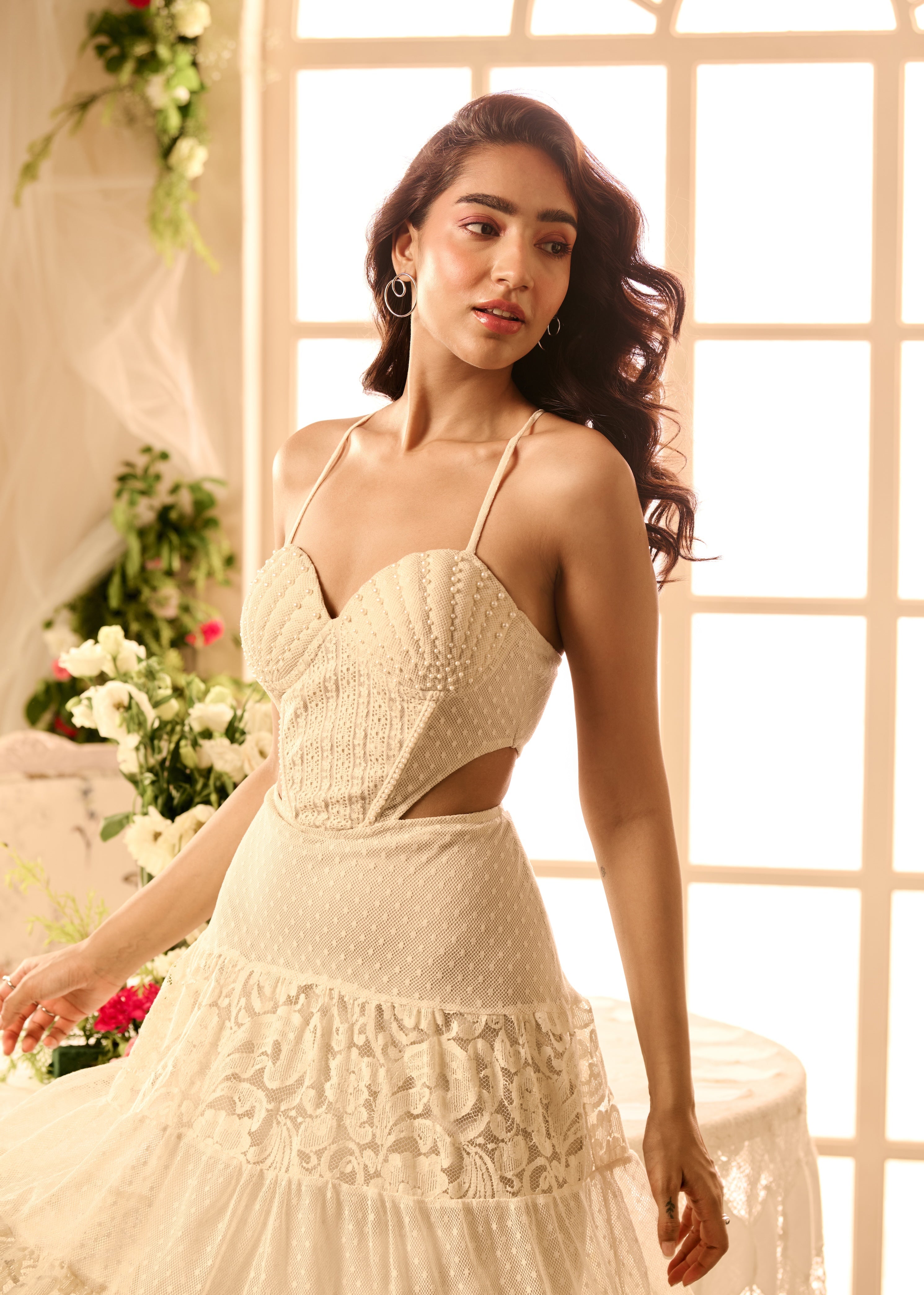 Willow White Cutout Dress with pearl embroidery, showcasing intricate pearl details and elegant cutout design in a pristine white fabric