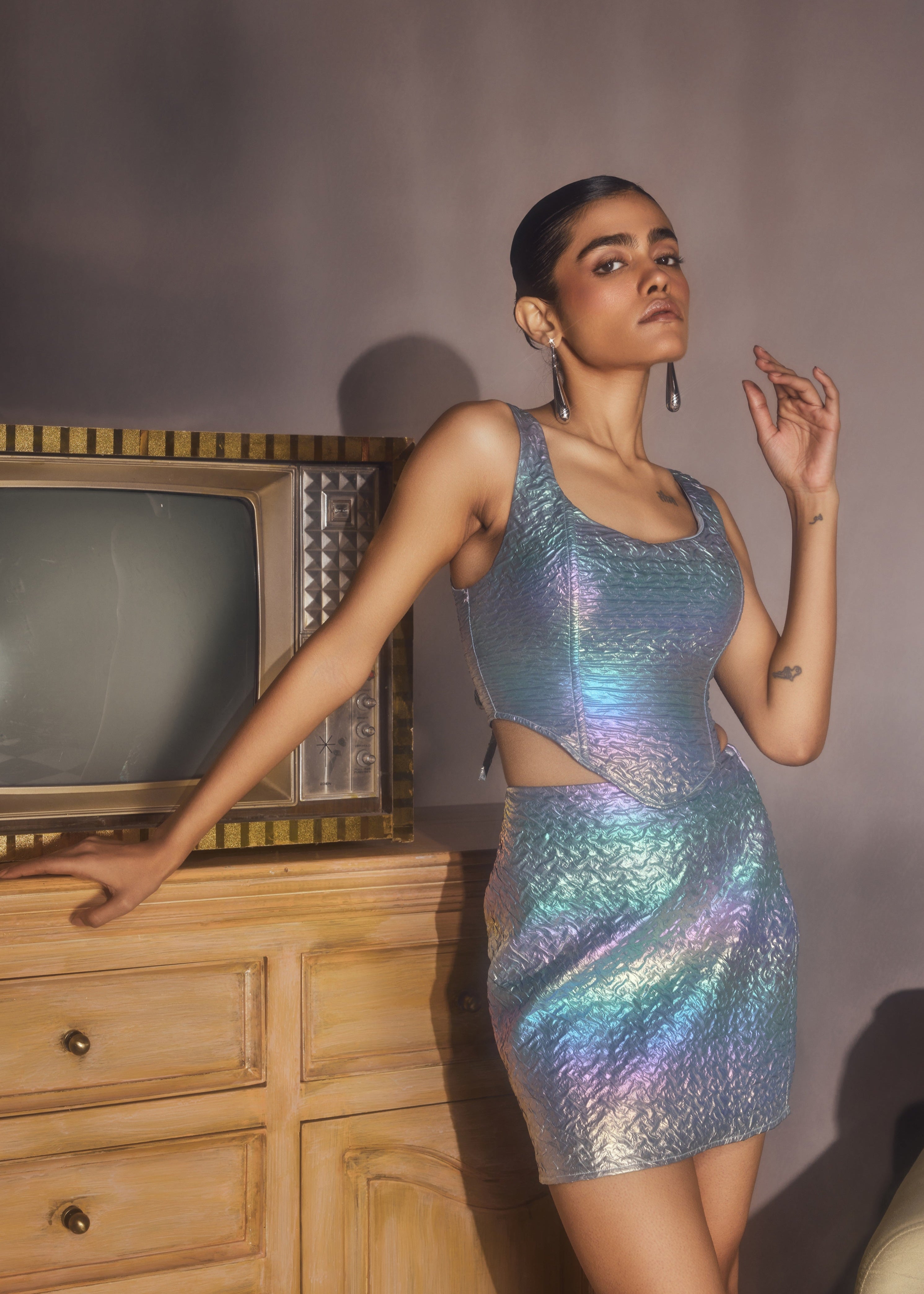 Zola Rainbow Holographic Corset and Mini Skirt Set, featuring a dazzling holographic finish and trendy design