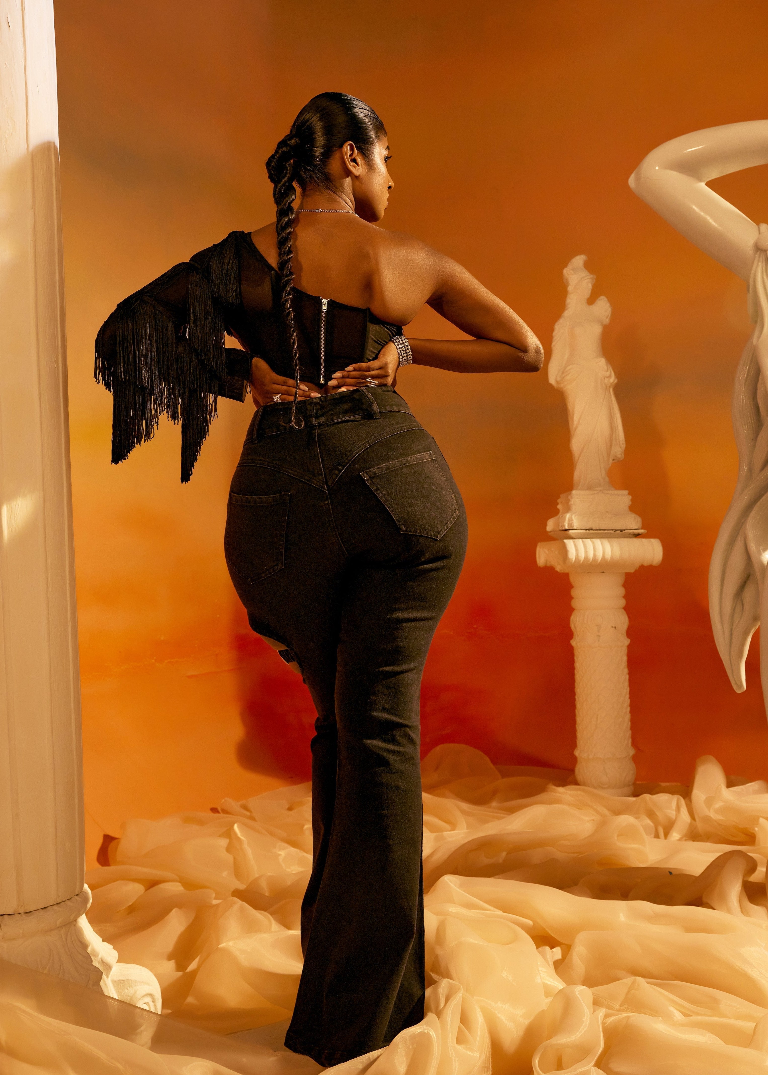 Arabella Black Tassel Sleeve Corset featuring dramatic tassel sleeves and a structured corset design in black