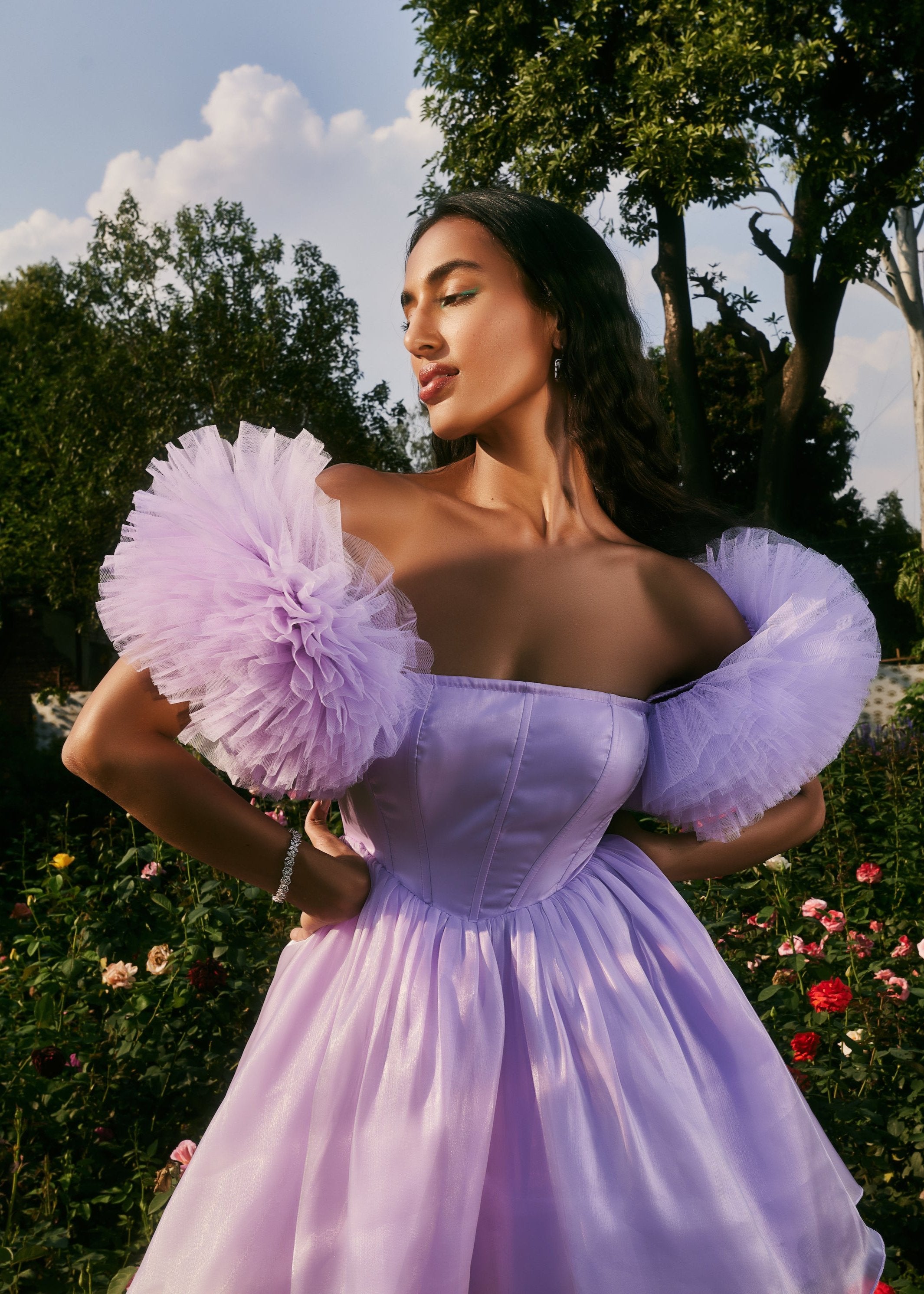 Carissa Lavender Shimmer Organza Corset Dress featuring a shimmering organza fabric in lavender with a structured corset design