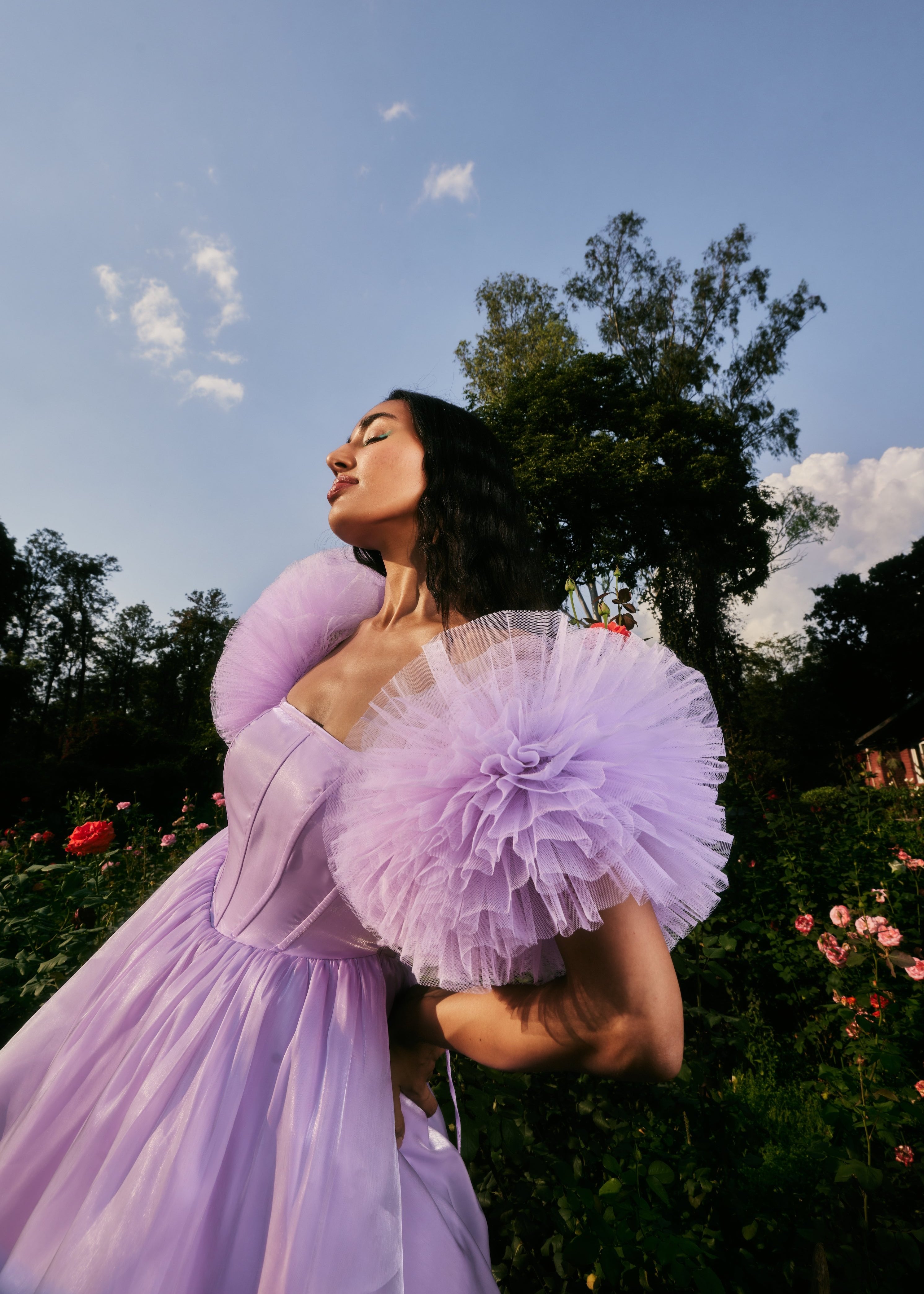 Carissa Lavender Shimmer Organza Corset Dress featuring a shimmering organza fabric in lavender with a structured corset design
