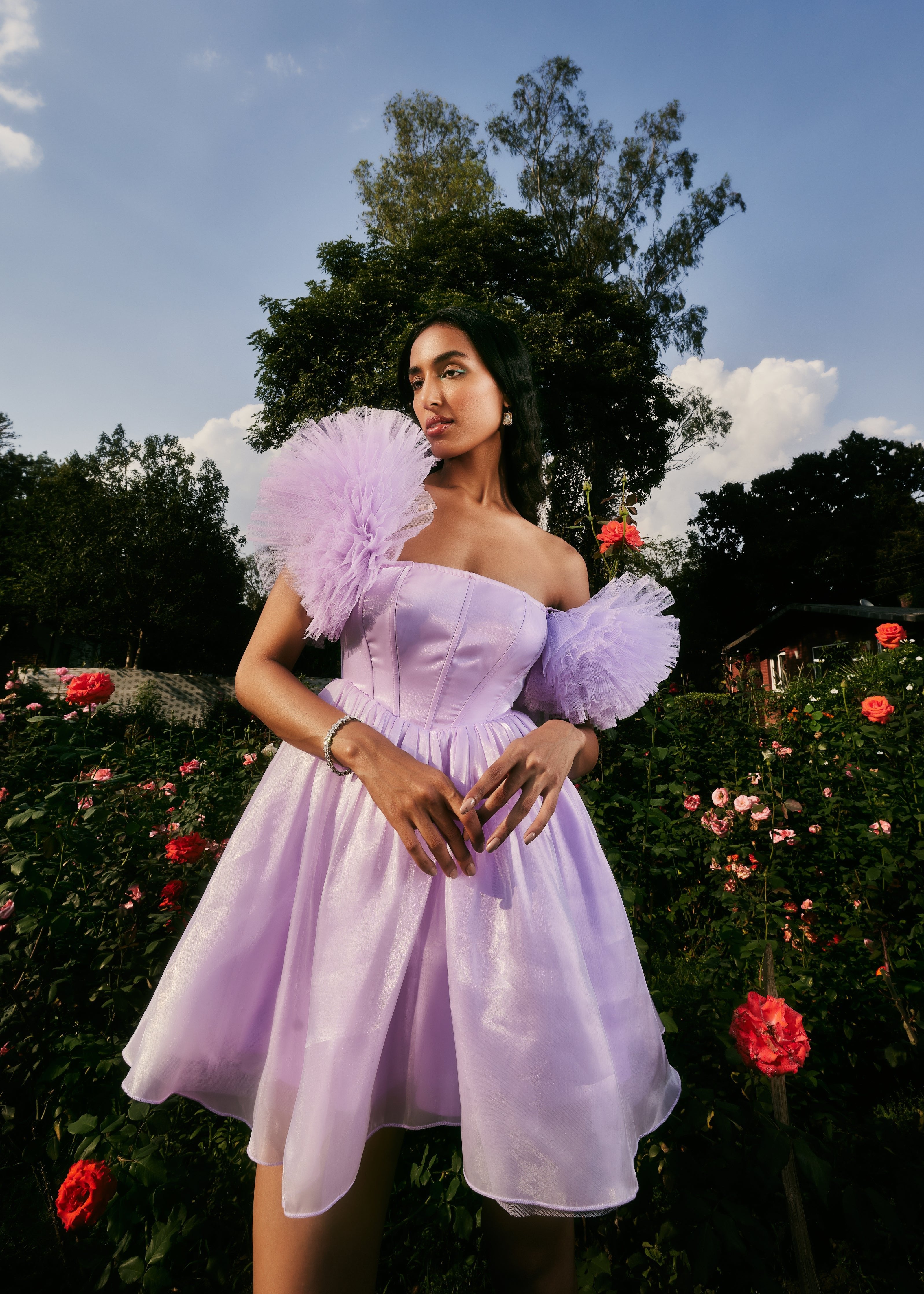 Carissa Lavender Shimmer Organza Corset Dress featuring a shimmering organza fabric in lavender with a structured corset design