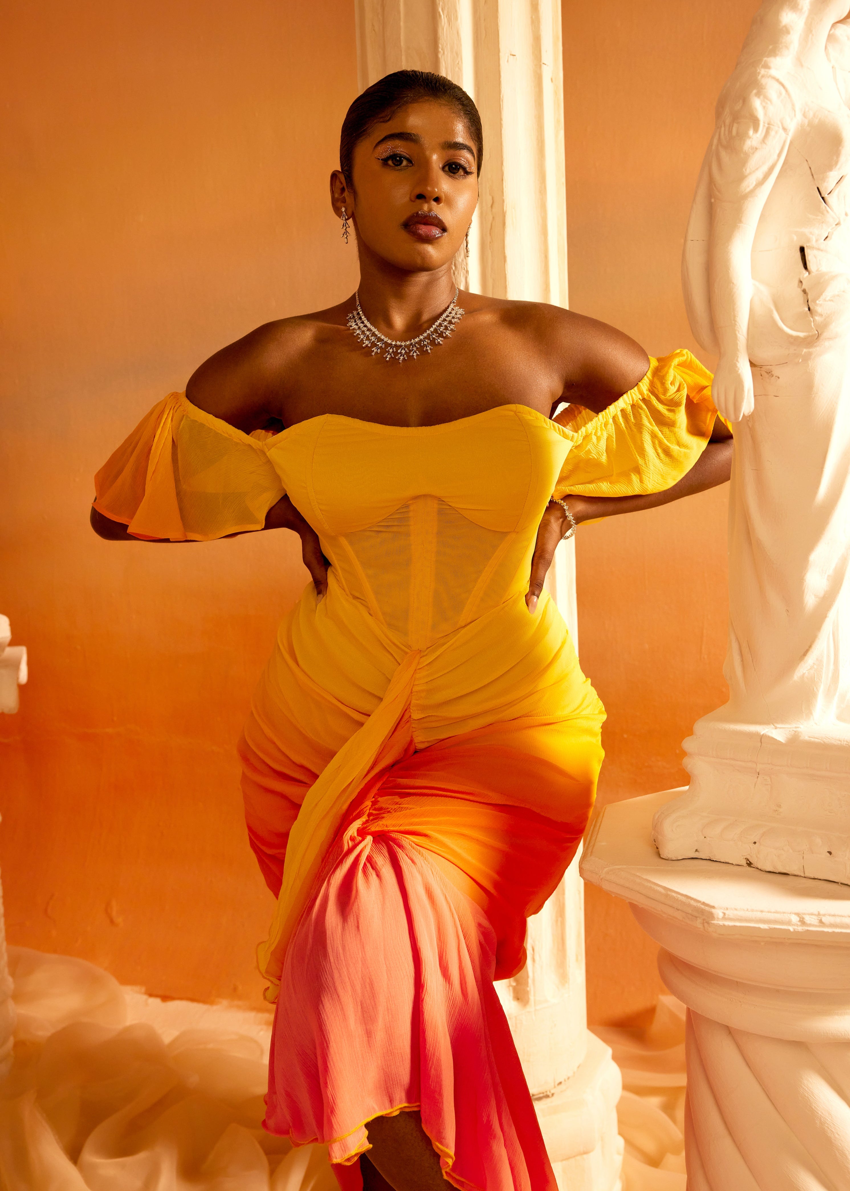 Greta Sunset Ombre Chiffon Corset Dress featuring a flowing chiffon fabric with a stunning sunset ombre gradient and a structured corset bodice