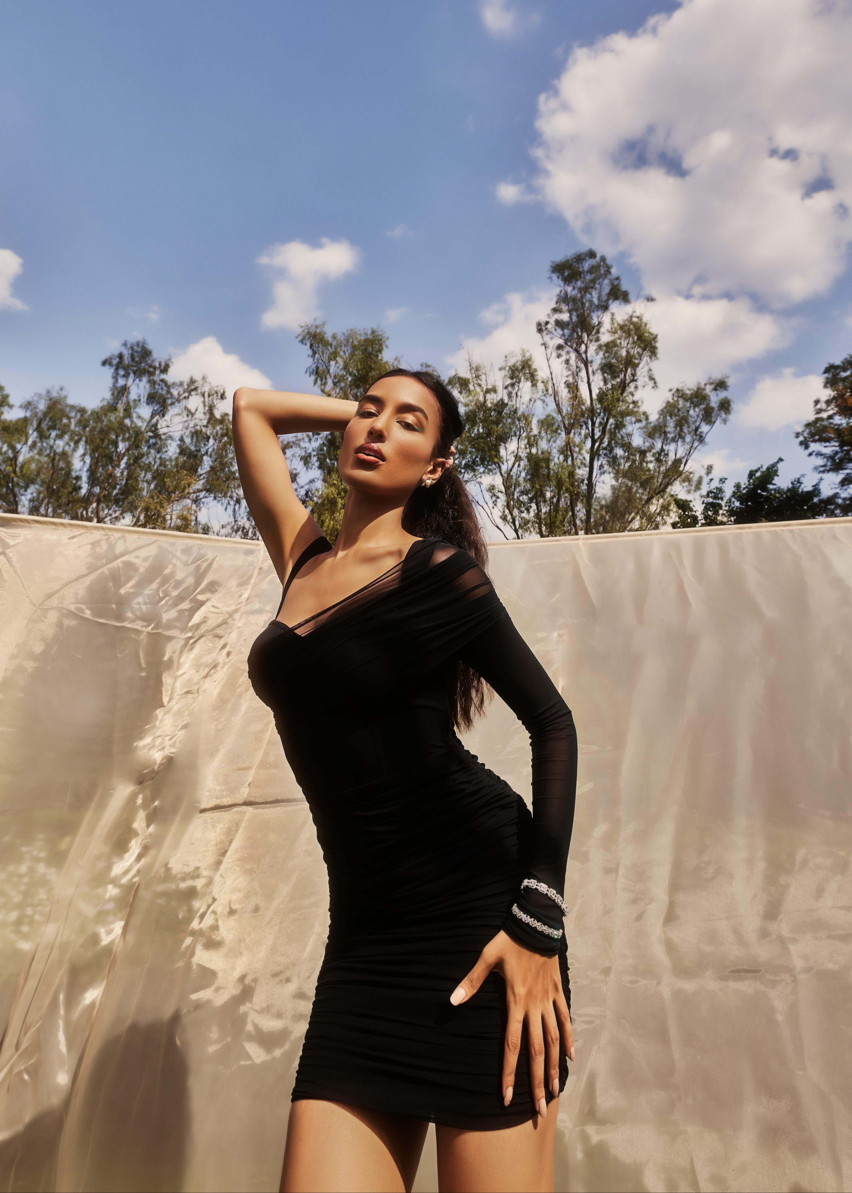 Gretchen Black Ruched Mesh Corset Dress with a sleek ruched mesh overlay and a structured corset silhouette in black