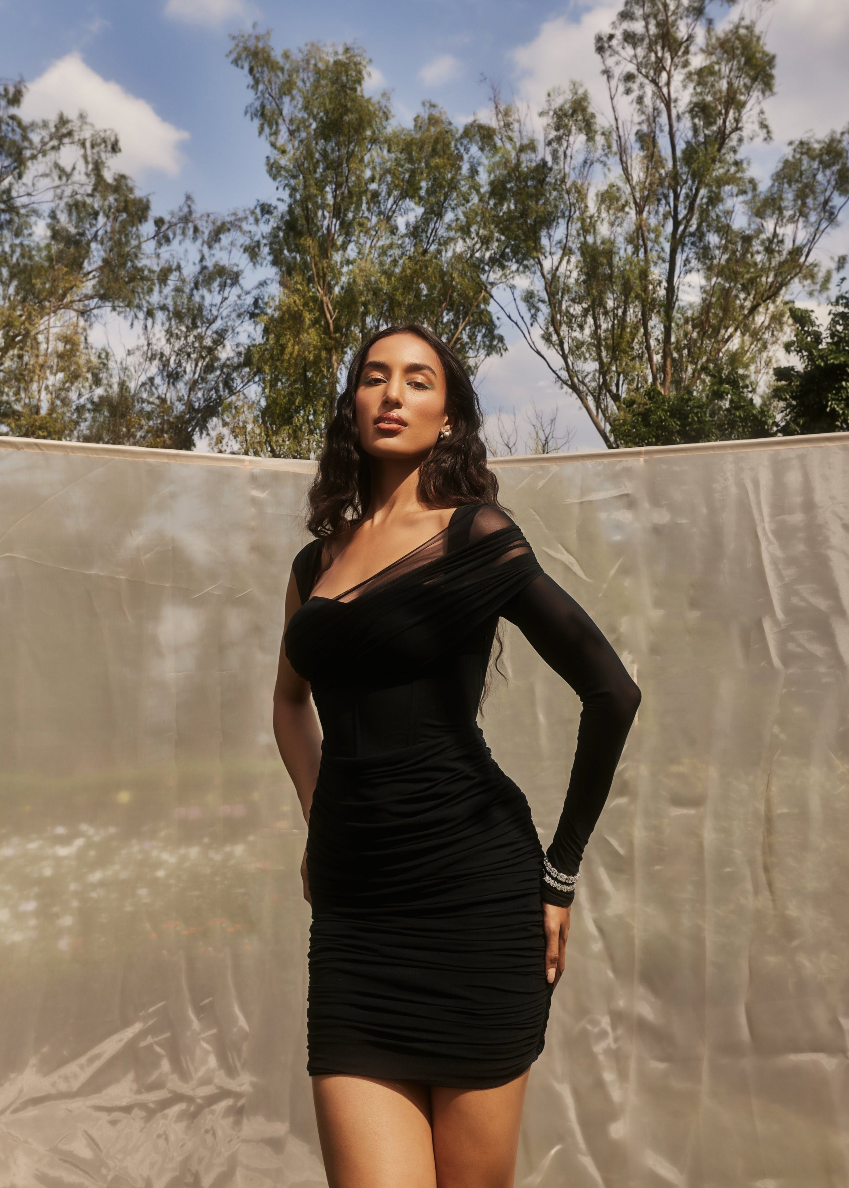 Gretchen Black Ruched Mesh Corset Dress with a sleek ruched mesh overlay and a structured corset silhouette in black