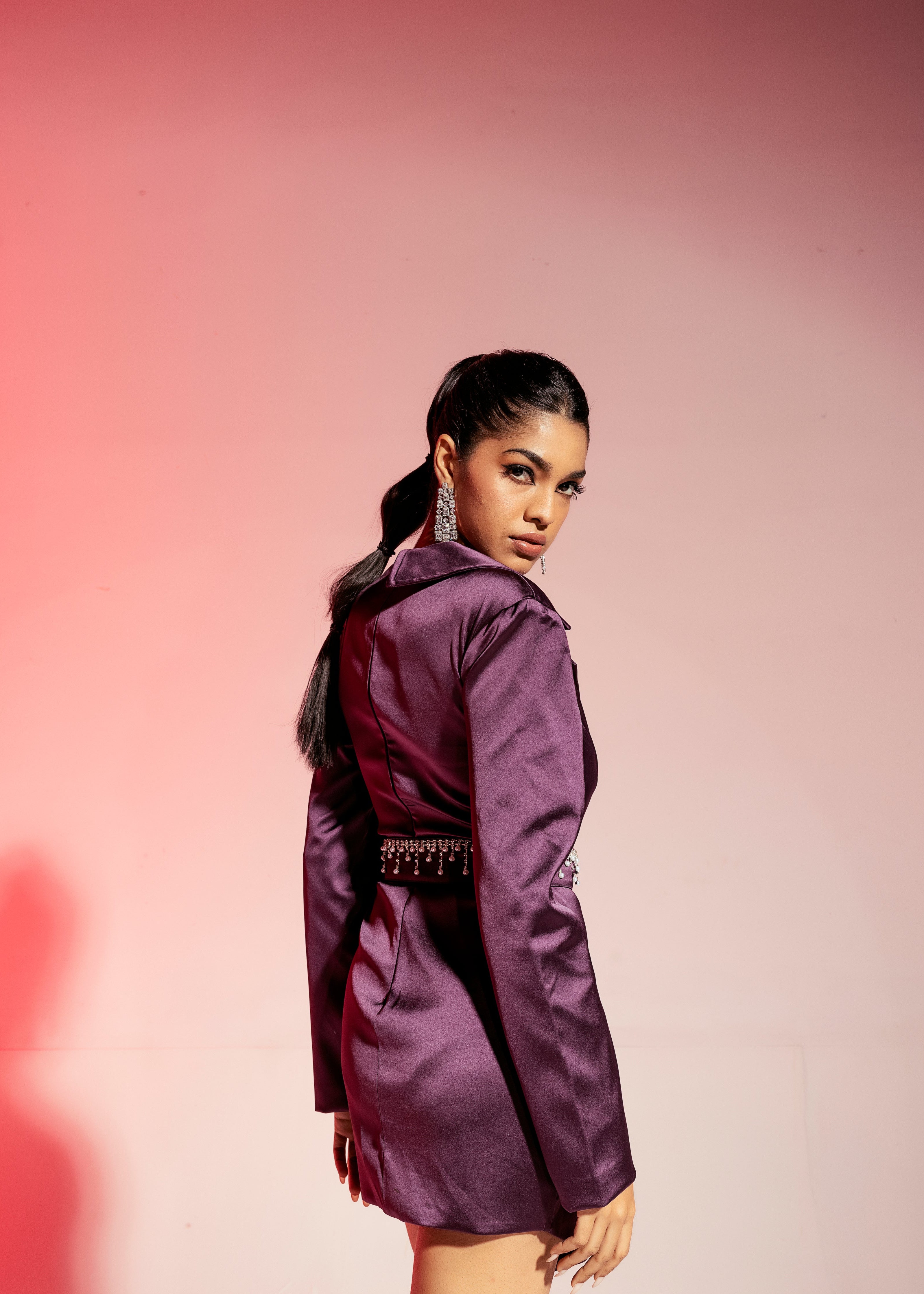 Purple satin blazer corset dress with a structured silhouette and a glossy finish