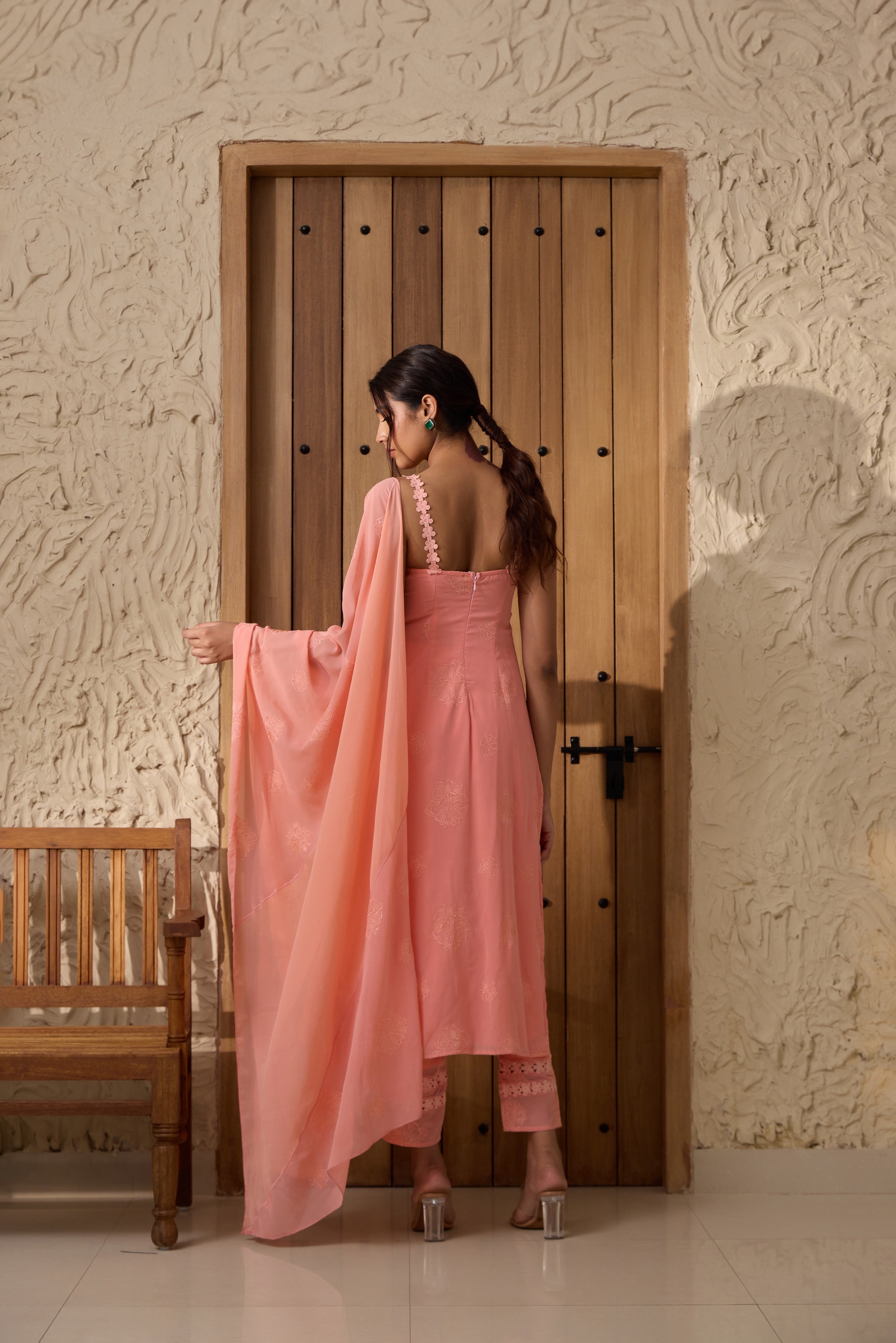 A pink georgette kurta set with intricate embroidery.