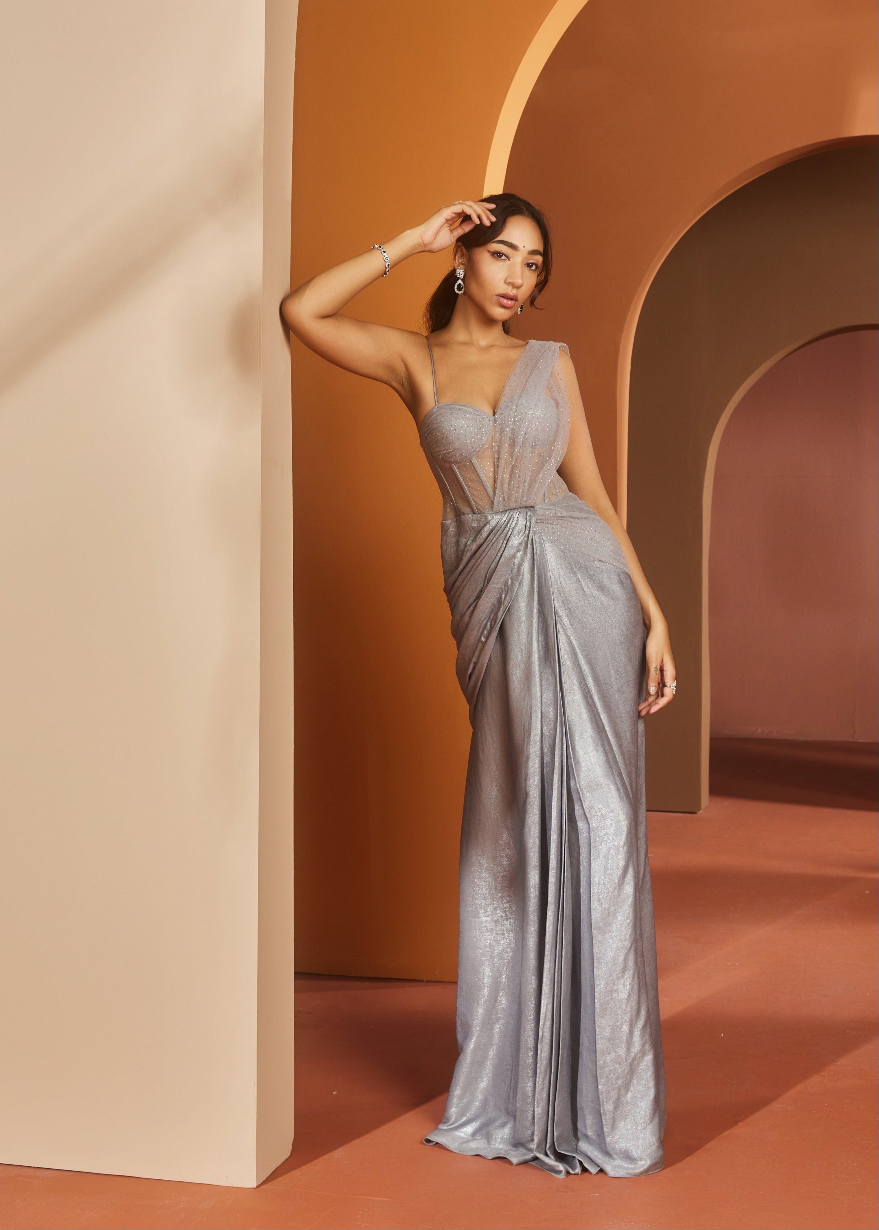 Elegant woman in a Faizah Grey Glitter Georgette One-Piece Saree Set, shimmering with sophistication