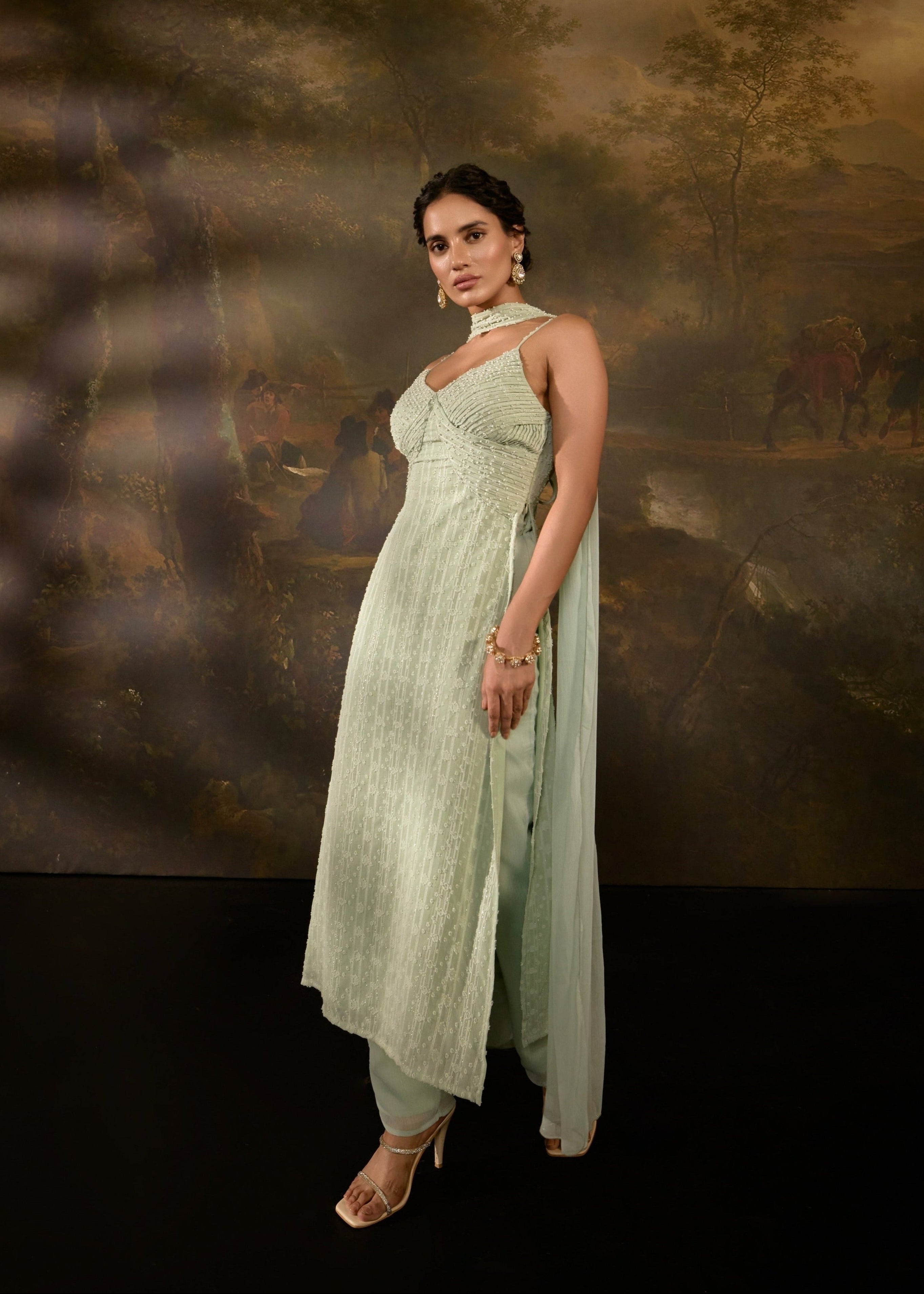 "Shimaz Sage Green Sleeveless Suit: Elegant sleeveless suit in sage green, offering a chic and modern look."